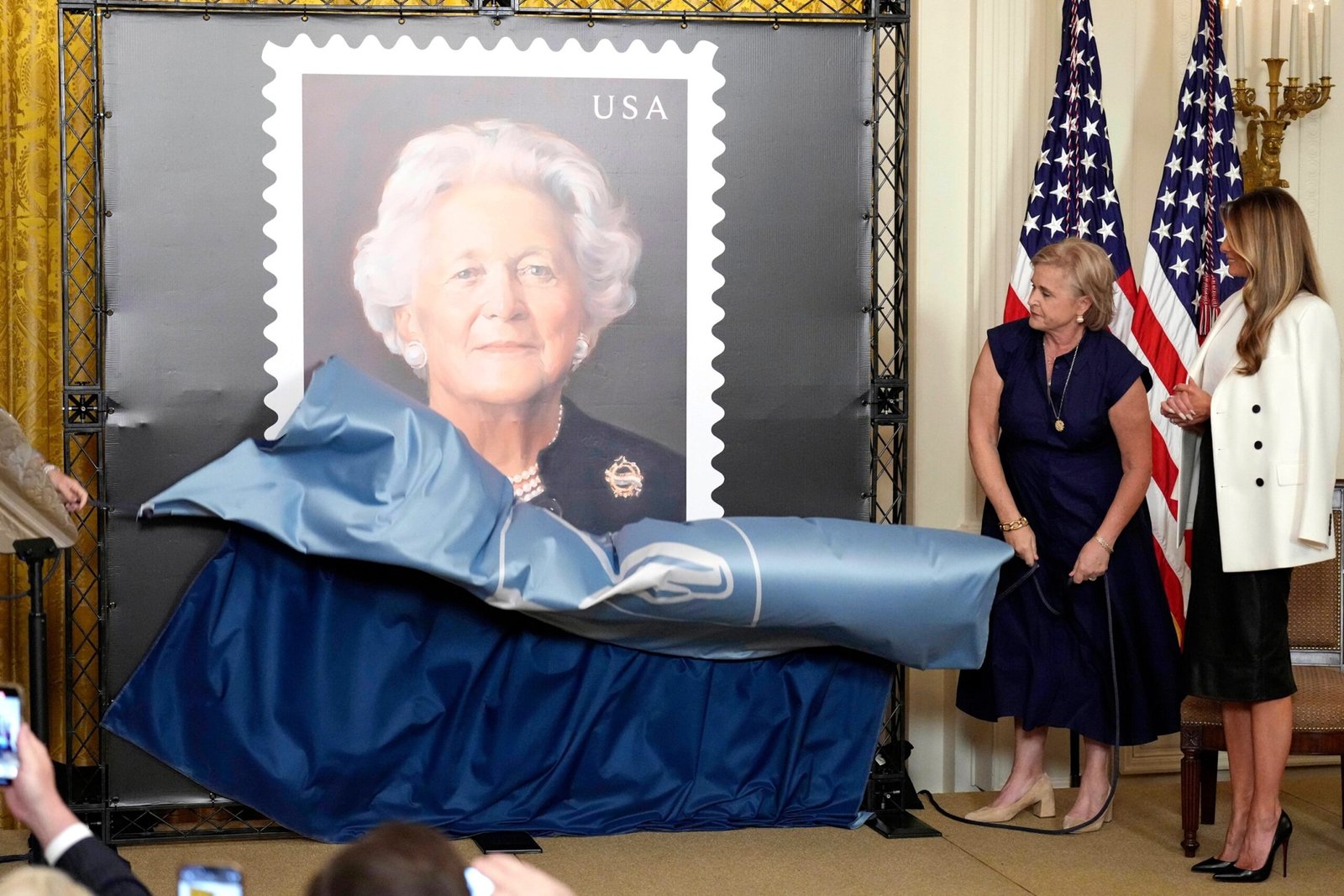 Melania Trump presents the seal in honor of Barbara Bush, with George W. Bush absent