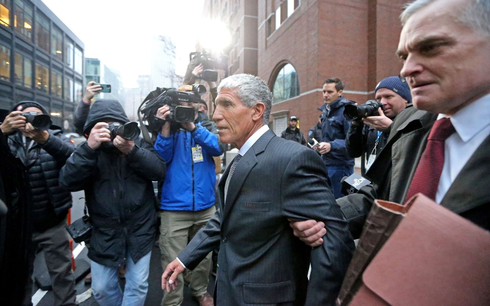 The master mind of the Varsity Blues William Rick Singer, Centro, leaves the Moakley Justice Palace after being sentenced to 3.5 years in prison on January 4, 2023 in Boston, Mass.