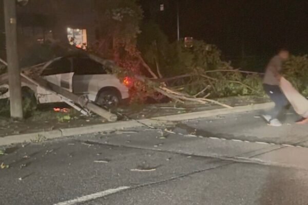 Army player Larry Picytt Jr. and Dad get the man out of the car just before he explodes in flames