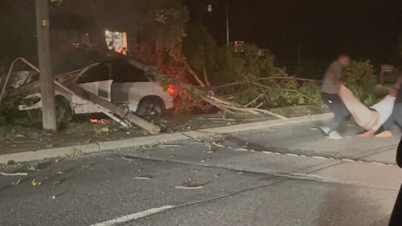 Army player Larry Picytt Jr. and Dad get the man out of the car just before he explodes in flames