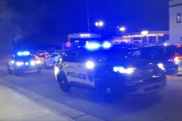 PHOTO: Several police vehicles sound sirens after reports of shots fired at Christmas Tree Lighting in Concord, North Carolina.