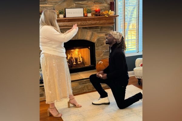 The family celebrates the second Thanksgiving dinner with the mailman who came to the father's aid